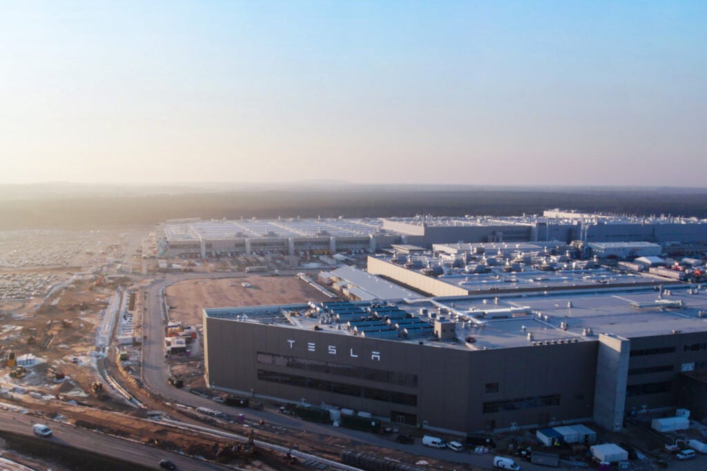 Cathie Wood Sells Tesla Shares, Increases Investment in Coinbase and Deere